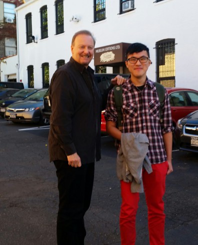 Oliver Tsai from South Williamsport High School takes a photo with Charles Fazzino
