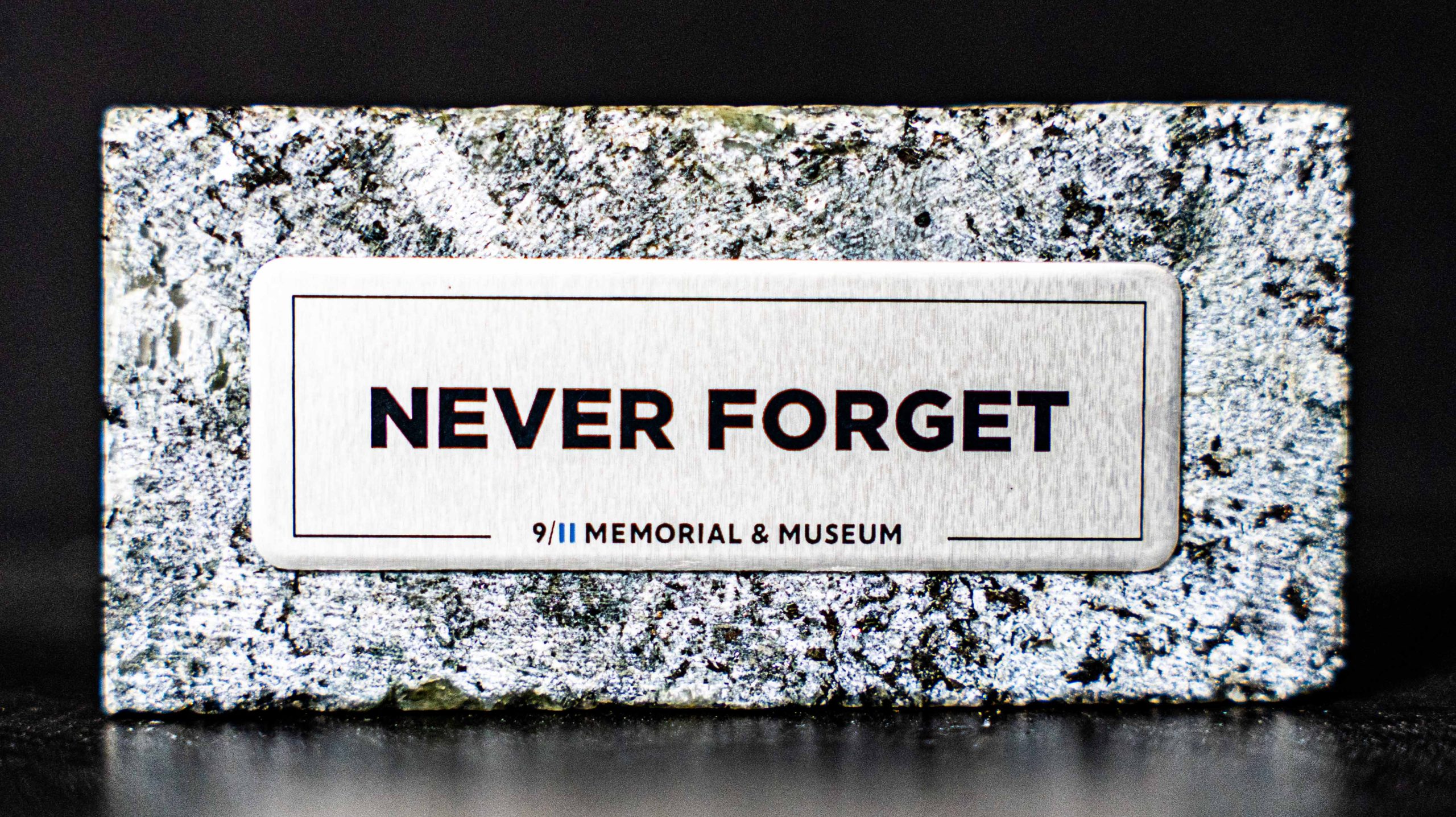 "Never Forget" granite keepsake from the 9/11 Memorial & Museum, carved from granite used to build the Memorial plaza
